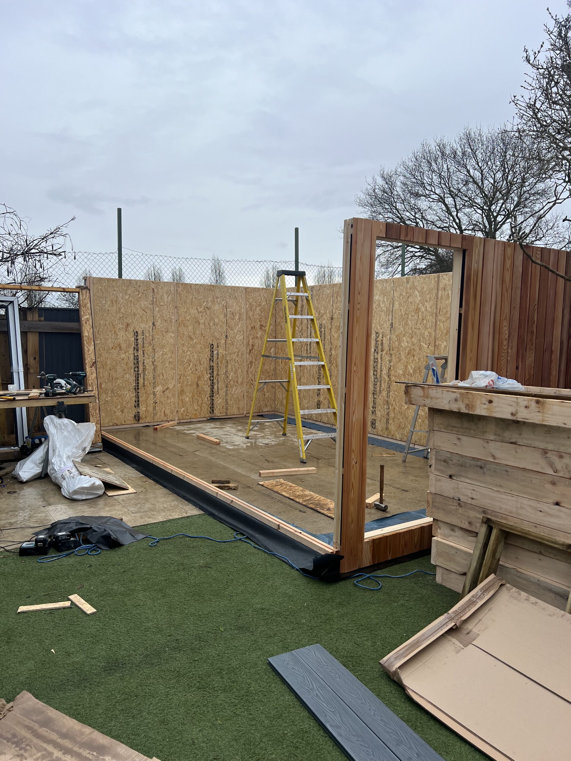Three walls of garden room structure in position during build, Surrey