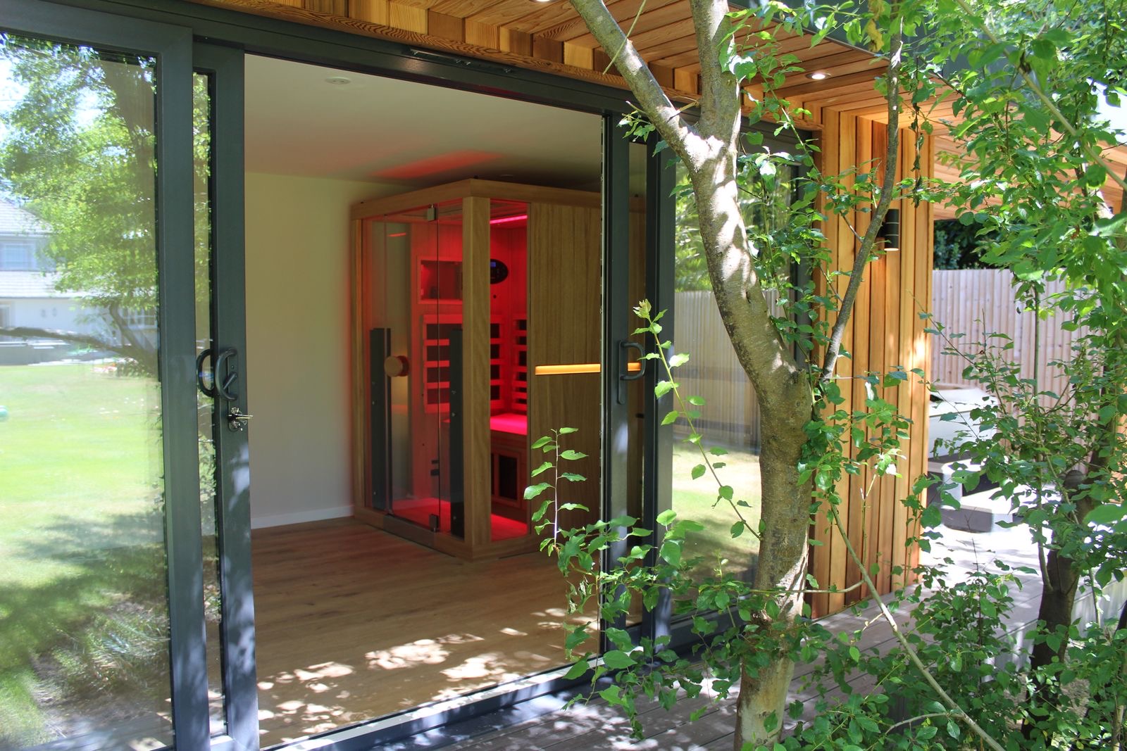Cedar shadow gap garden room with infrared sauna and wellness space