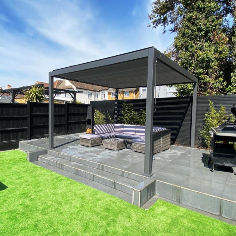 3.6m square grey aluminium louvred pergola on a raised patio